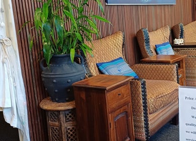 Cozy seating area at Touch of Grace Beauty, Morningside, Queensland, AU with elegant chairs and vibrant decor.
