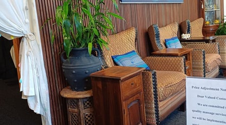 Cozy seating area at Touch of Grace Beauty, Morningside, Queensland, AU with elegant chairs and vibrant decor.