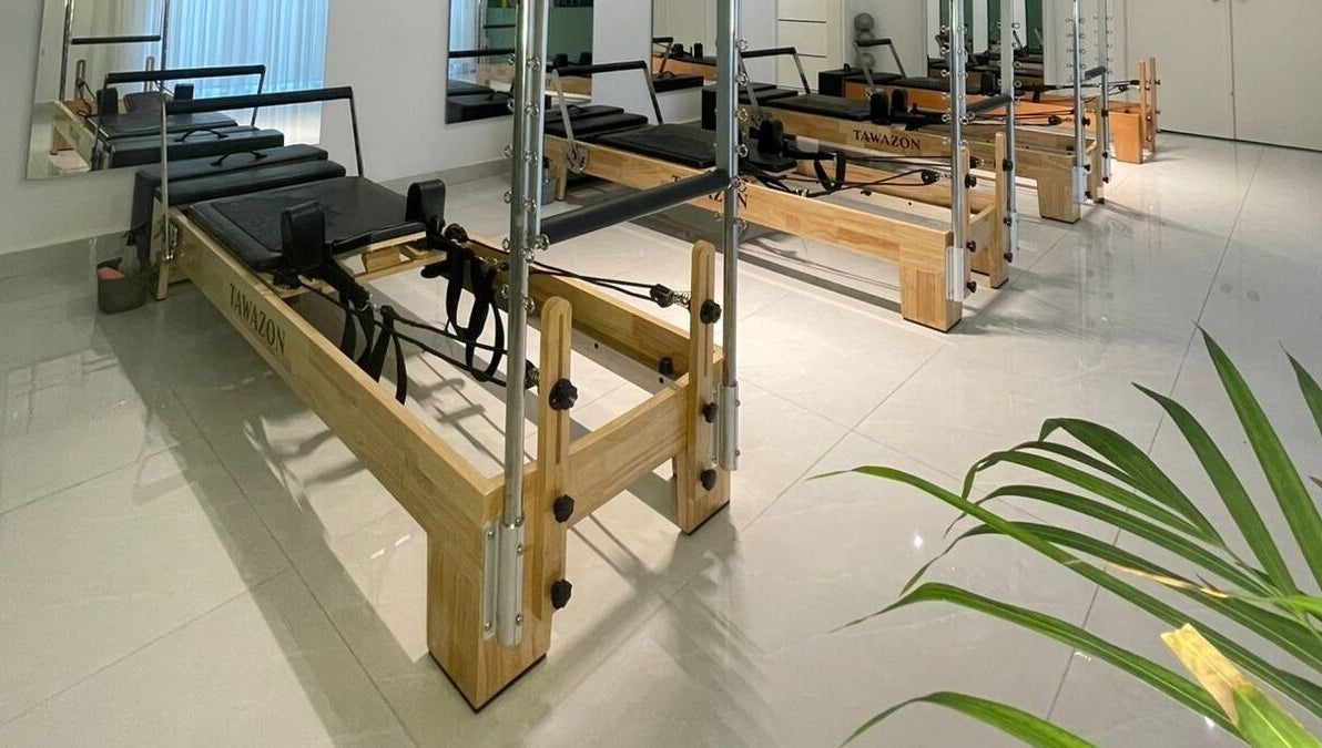 Pilates reformers at Tawazon Studio, Tarablus, North Governorate, LB, offering a serene workout environment.