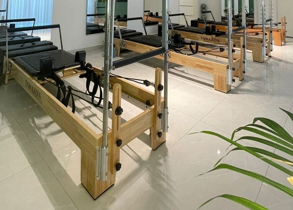 Pilates reformers at Tawazon Studio, Tarablus, North Governorate, LB, offering a serene workout environment.