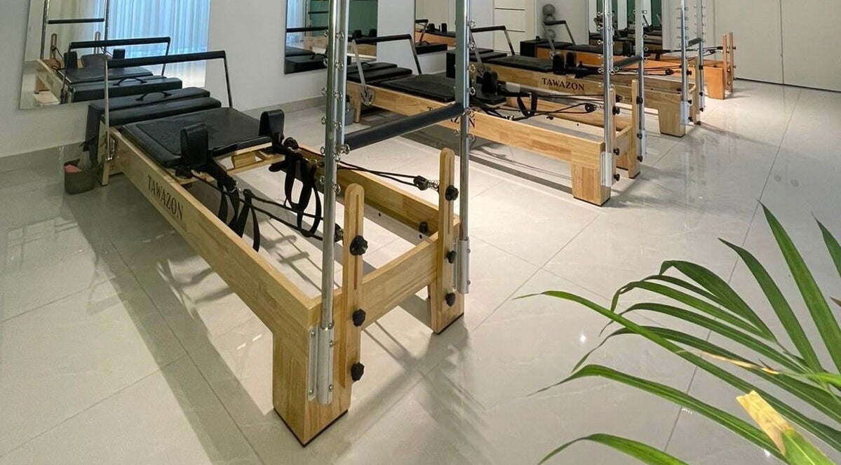 Pilates reformers at Tawazon Studio, Tarablus, North Governorate, LB, offering a serene workout environment.