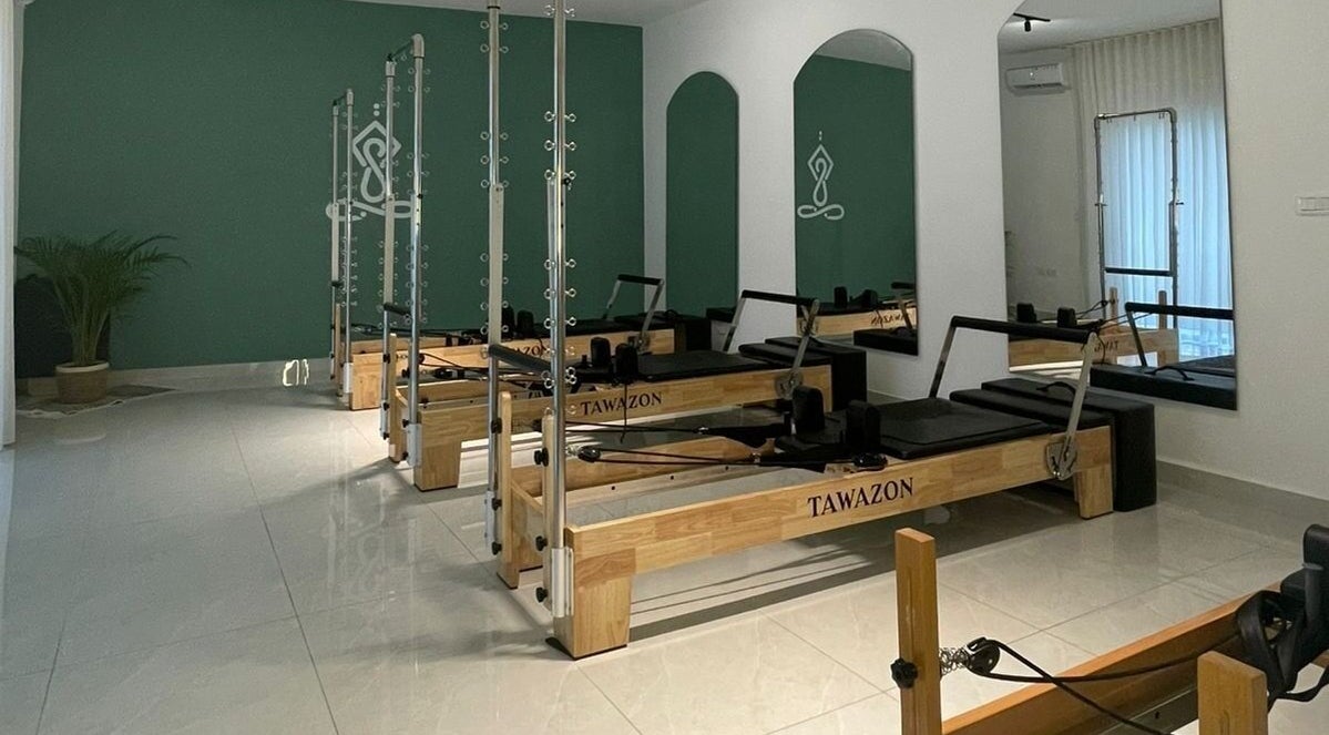 Pilates reformers in Tawazon Studio, Tarablus, North Governorate, LB, offering a tranquil workout environment.