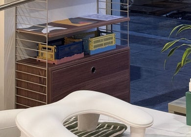 Organized shelves with decor at TWO COATS, Glasgow, Scotland, GB enhance a stylish wellness ambiance.