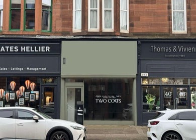 Front view of TWO COATS in Glasgow, Scotland, GB showcasing elegant storefront design.