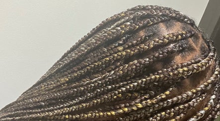 Intricate braided hairstyle at HairLuxe by Chinygold, Leeds, England, GB, showcasing expert hair design.