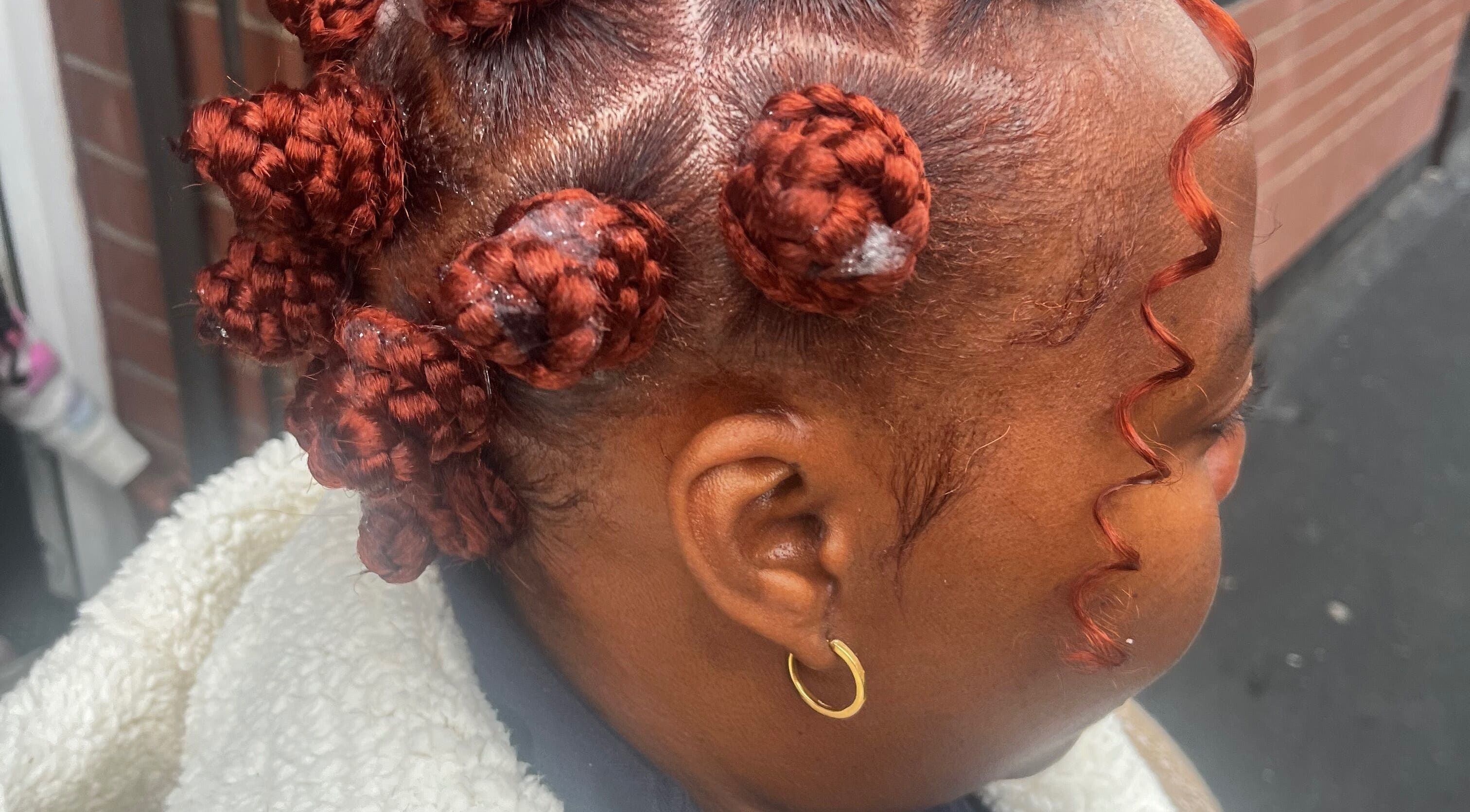 Intricate braided hairstyle showcased at HairLuxe by Chinygold in Leeds, England, GB.
