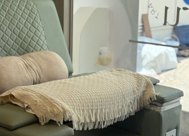 Cozy lounge chair at Ne-I-Ru in กรุงเทพมหานคร, TH, perfect for relaxation.