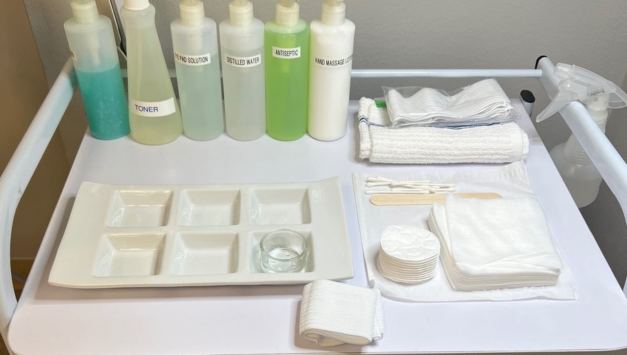 Skincare tools at Naked Lumina Skin + Esthetics, Houston, Texas, US, featuring toners and towels for treatments.