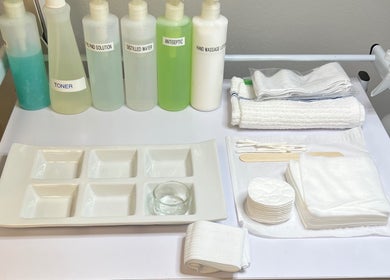 Skincare tools at Naked Lumina Skin + Esthetics, Houston, Texas, US, featuring toners and towels for treatments.