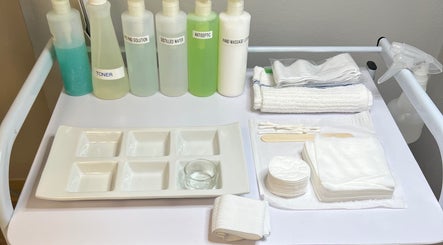 Skincare tools at Naked Lumina Skin + Esthetics, Houston, Texas, US, featuring toners and towels for treatments.