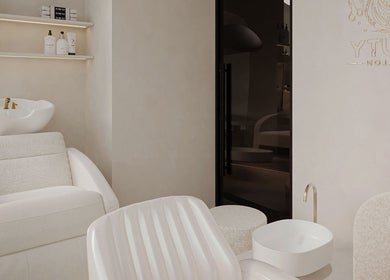 Modern treatment area at Golden Glow Beauty Home Services, Dubai, Dubai, AE, featuring luxury spa chairs.