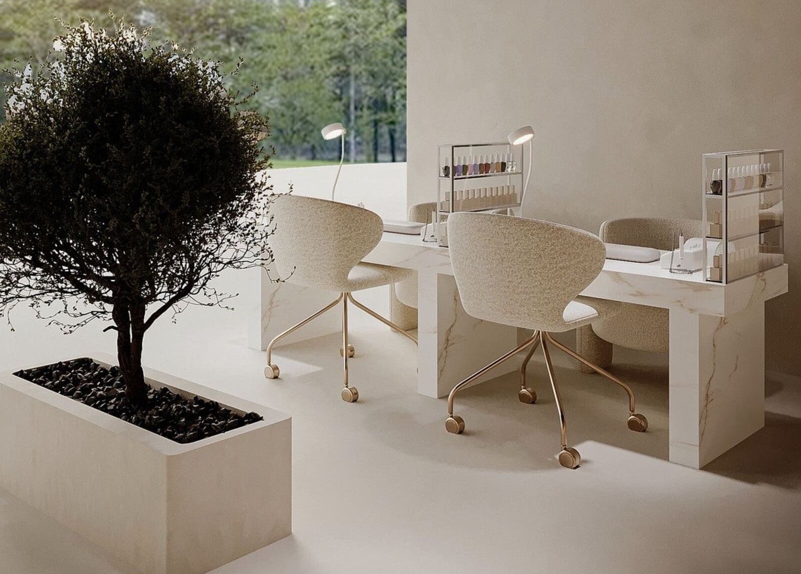 Elegant nail station at Golden Glow Beauty Lounge, Dubai, Dubai, AE with marble table and plush chairs.