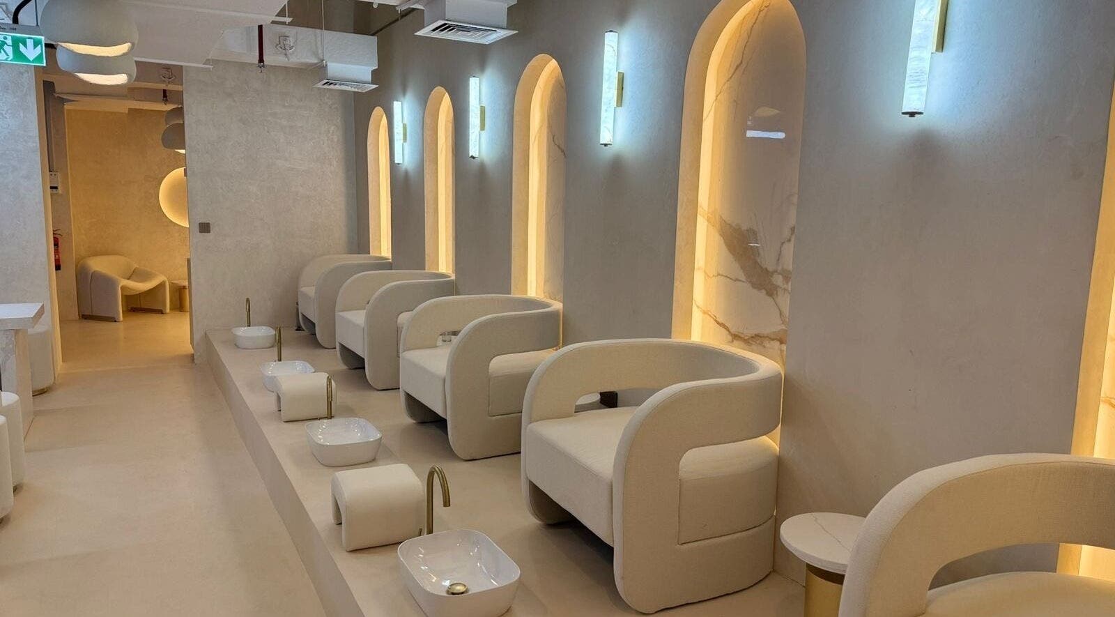 Luxurious seating area at Golden Glow Beauty Lounge, Dubai, Dubai, AE. Modern and serene spa interior.