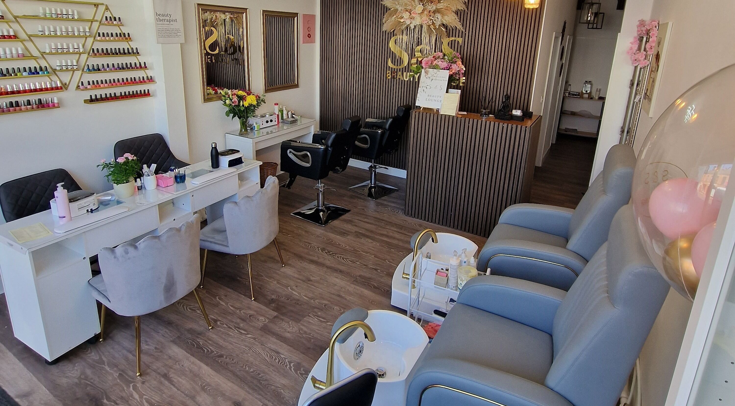 Interior view of S&S BEAUTY LOUNGE in Windsor, England, GB featuring chairs and nail stations.