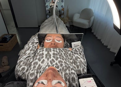 Client receiving eyelash treatment at Linèa Beauty, Acacia Ridge, Queensland, AU, in a relaxing setting.