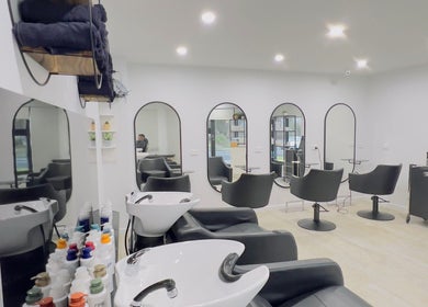 Elegant salon setup at Kondethestylist, Melbourne, Victoria, AU with stylish chairs and modern decor.