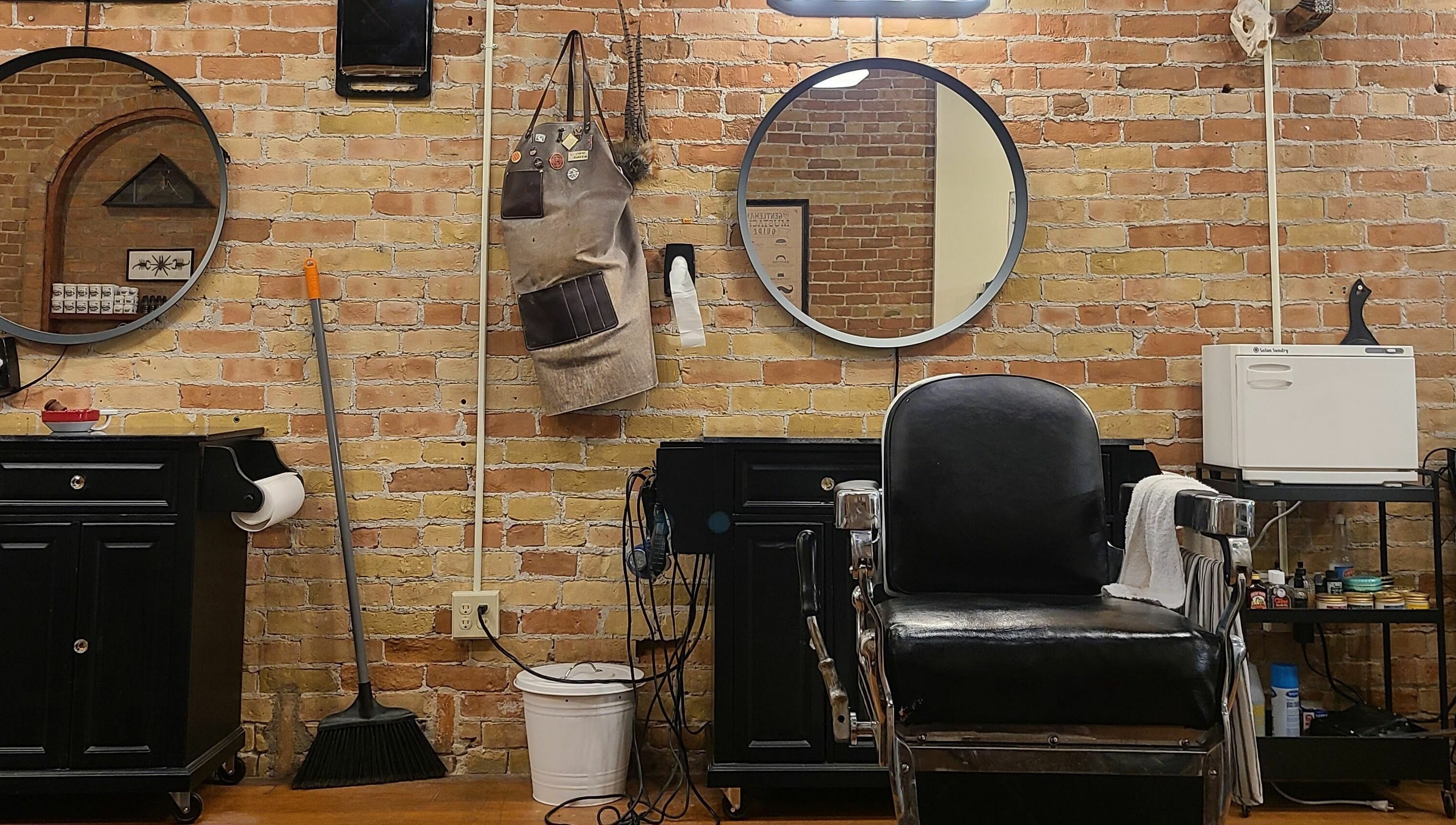 Chic barber station at The Man Barber LLC, Provo, Utah, US with a vintage chair and grooming tools.