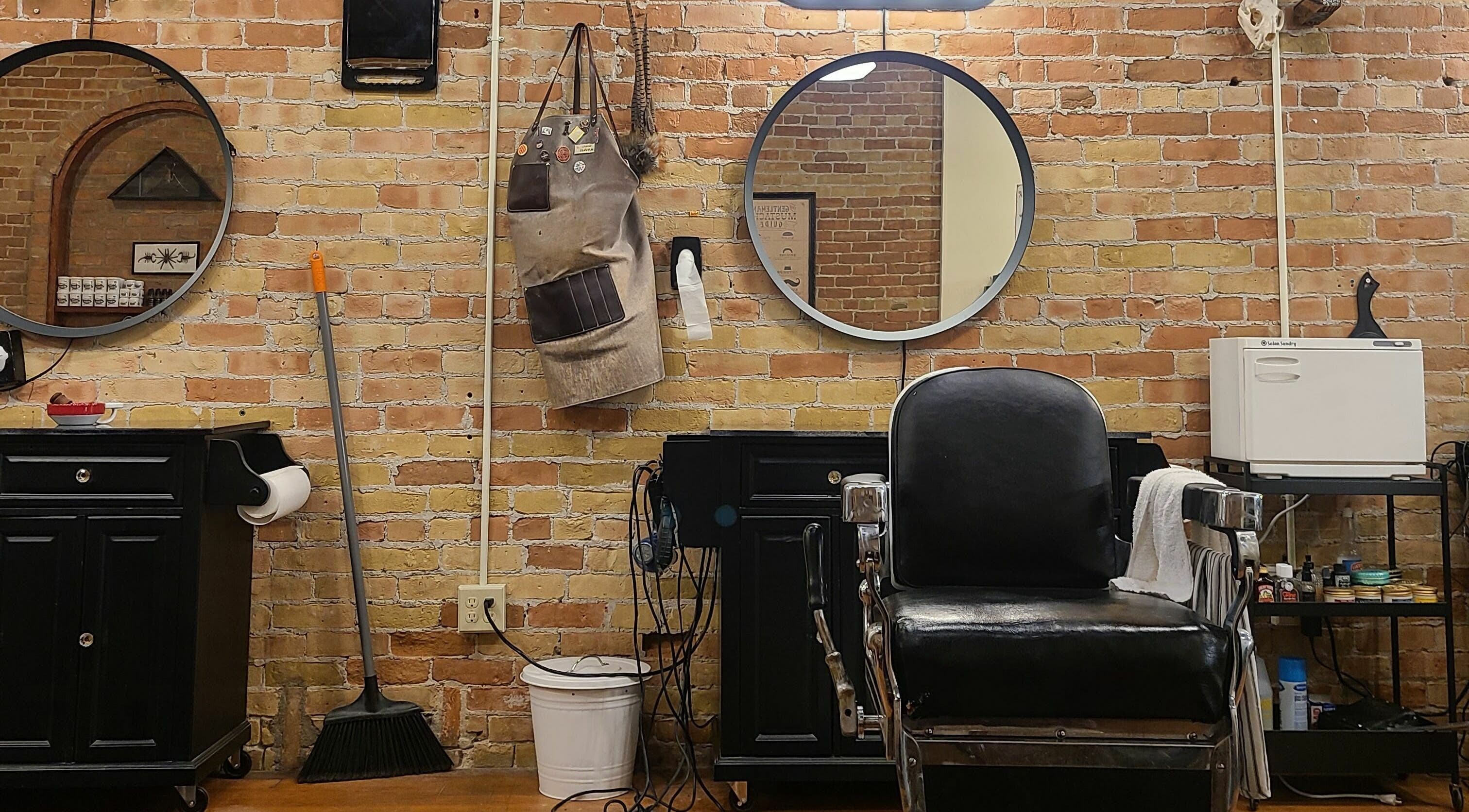 Chic barber station at The Man Barber LLC, Provo, Utah, US with a vintage chair and grooming tools.