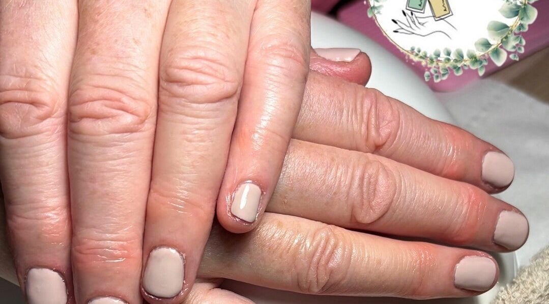 Elegant manicured hands at Beauty By Gracy, Mallow, County Cork, IE showcasing nude nail polish.