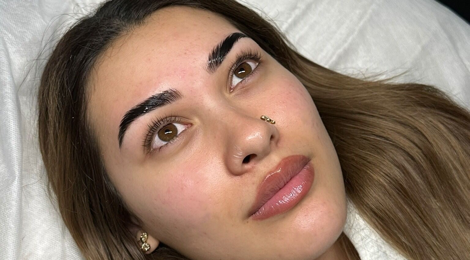 Close-up of woman after brow treatment at Arched Oasis, Melbourne, Victoria, AU.