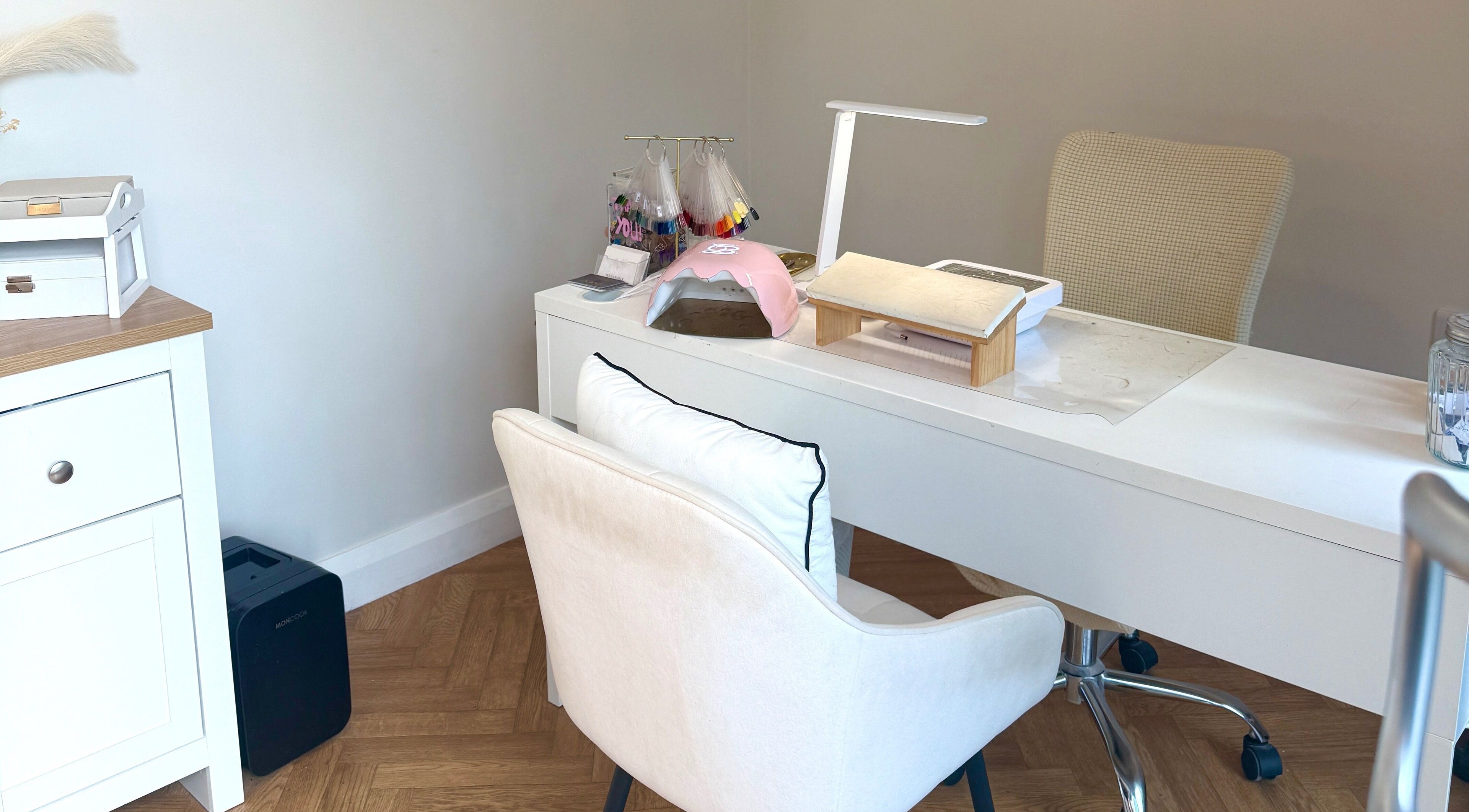 Elegant nail station at Nasa Nails, Craigavon, Northern Ireland, GB with white decor and modern equipment.