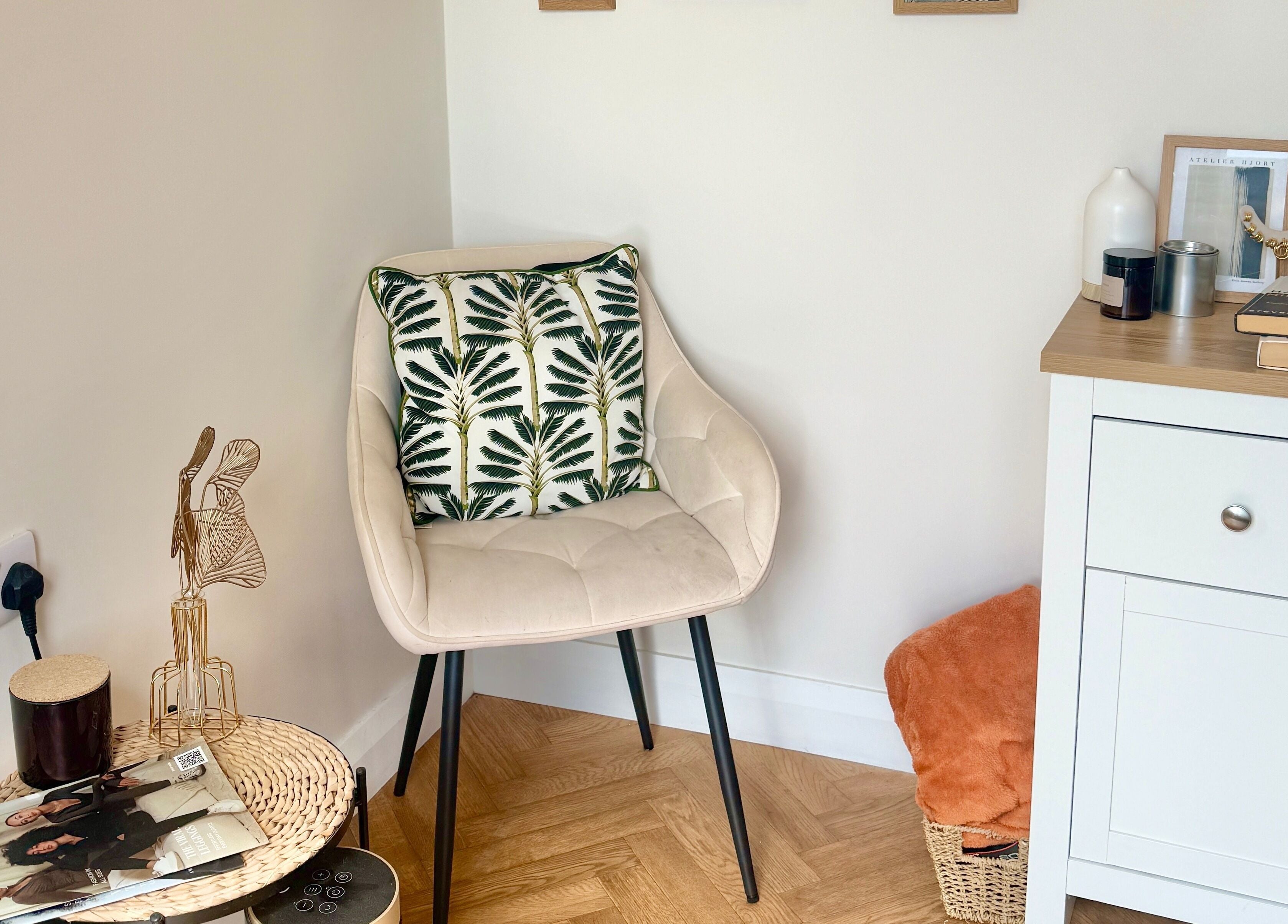 A stylish chair with a leafy cushion beside a tidy cabinet at Nasa Nails, Craigavon, Northern Ireland, GB.
