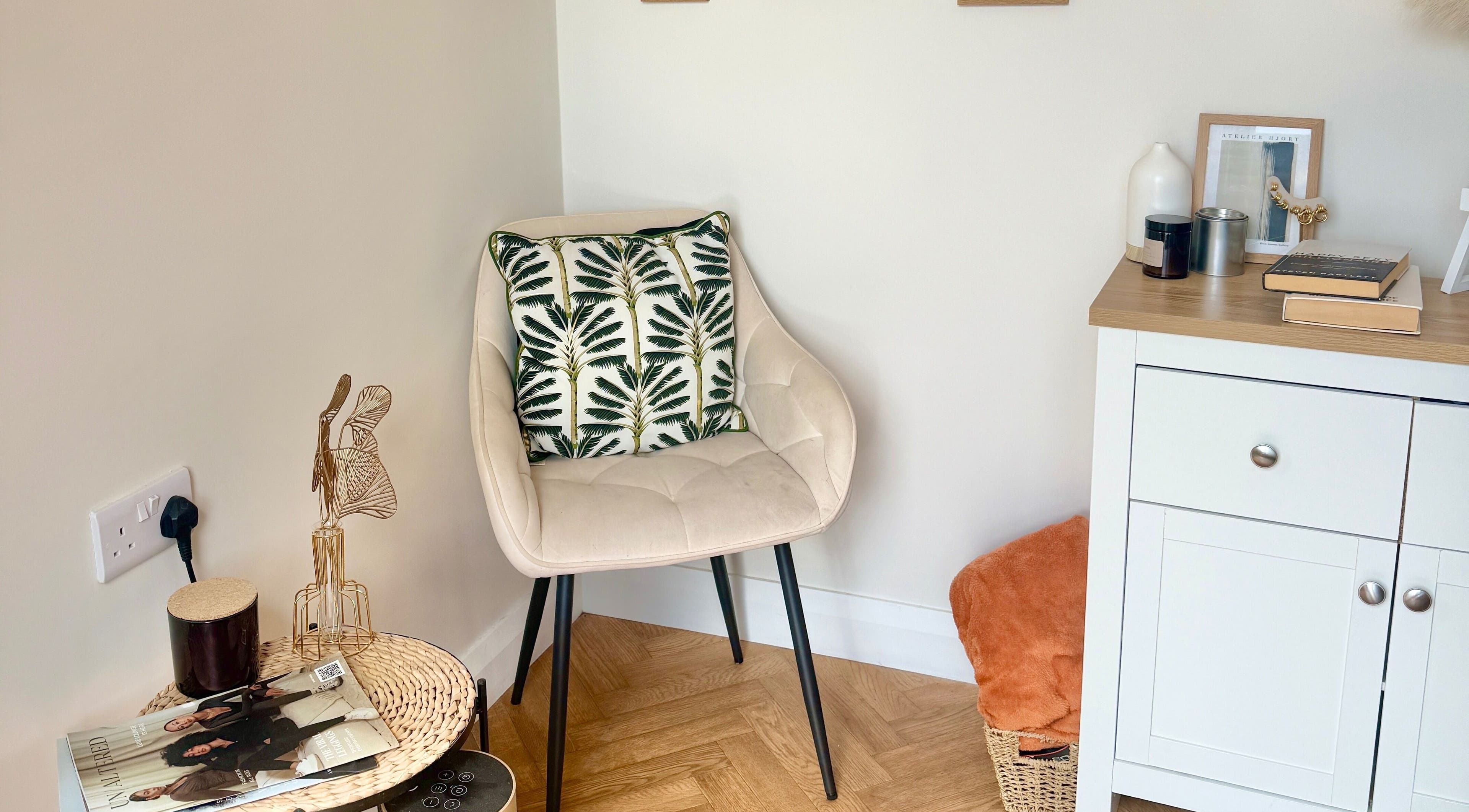A stylish chair with a leafy cushion beside a tidy cabinet at Nasa Nails, Craigavon, Northern Ireland, GB.