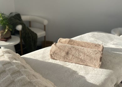 Knead To Relax massage room with plush towels in Regency Downs, Queensland, AU.