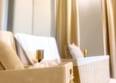 Luxurious spa lounge at Opulence Serenity, Subiaco, Western Australia, AU with beige decor and cozy seating.