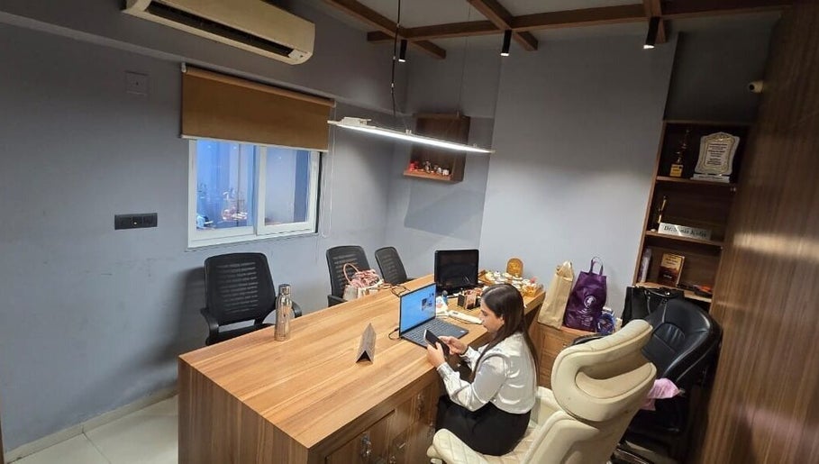 Modern office space at Skintude in Ahmedabad, Gujarat, IN with wood desk and stylish seating.