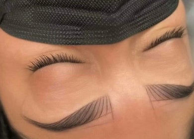Close-up of expertly shaped eyebrows at Skintude, Ahmedabad, Gujarat, IN, showcasing precise microblading.