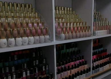 Nail polish collection at Dream Skin Aesthetics, Stanford, Western Cape, ZA. Vibrant colors on display.
