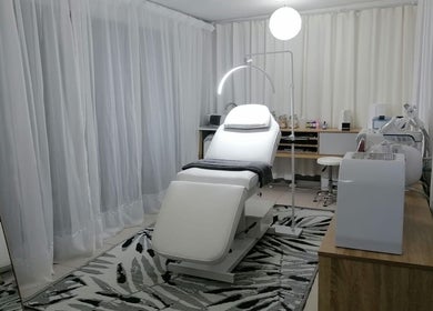 Tranquil treatment room at Dream Skin Aesthetics, Stanford, Western Cape, ZA, featuring a plush treatment bed.