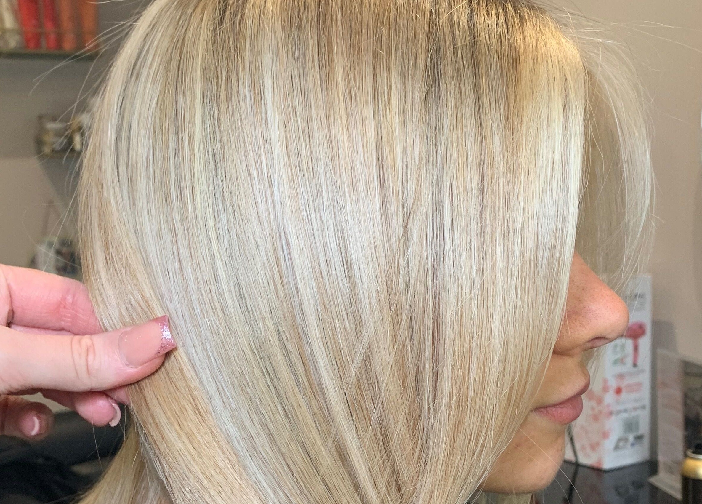 Close-up of shiny blonde hair styled at Hair by Hannah, Bentley Heath, England, GB.