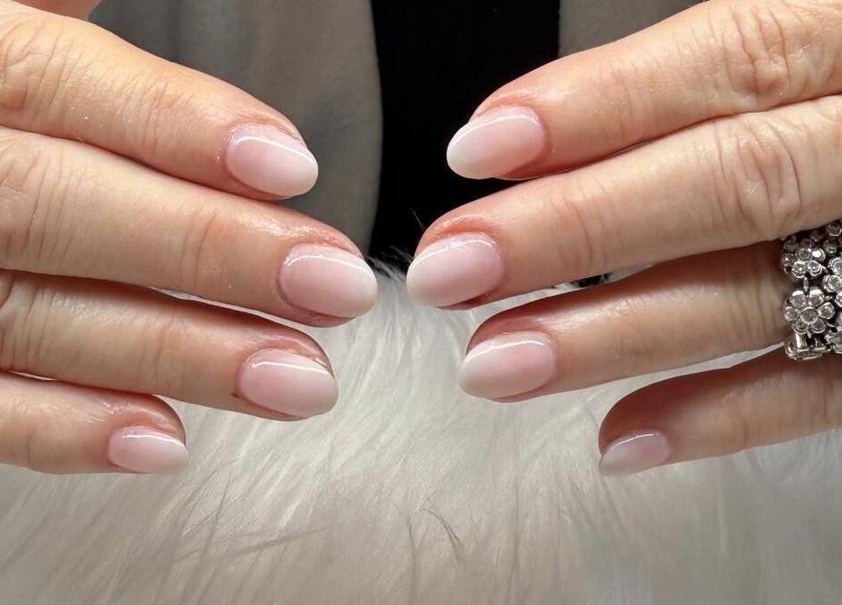Stylish manicured nails at Scarlett Nails Studio, Dee Why, New South Wales, AU with a floral ring.