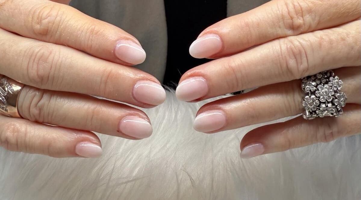 Stylish manicured nails at Scarlett Nails Studio, Dee Why, New South Wales, AU with a floral ring.