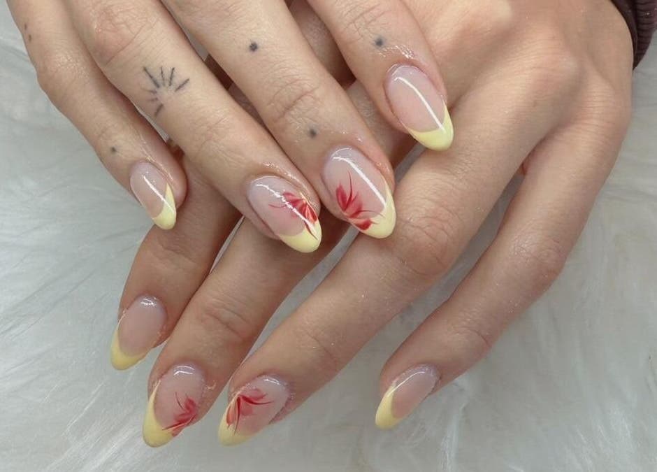 Elegant floral nail art with yellow tips at Scarlett Nails Studio, Dee Why, New South Wales, AU.