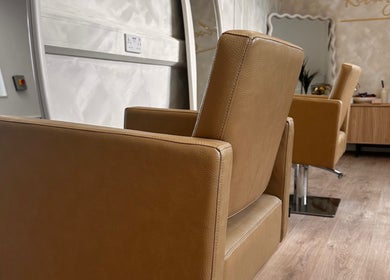 Sophisticated salon chairs at Kelseigh Walsh Hair - Studio in Anstey, England, GB, showcasing modern beauty ambiance.