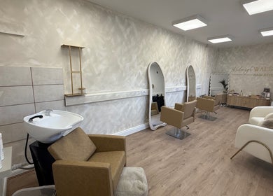 Elegant interior of Kelseigh Walsh Hair - Studio in Anstey, England, GB with stylish chairs and mirrors.