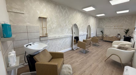 Modern interior of Kelseigh Walsh Hair - Studio in Anstey, England, GB with sleek salon chairs and styling mirrors.
