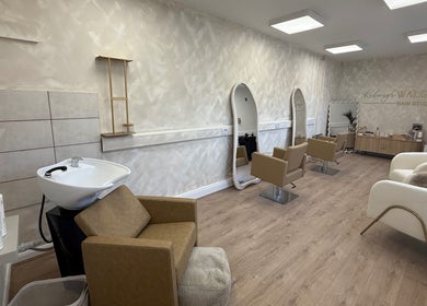 Modern interior of Kelseigh Walsh Hair - Studio, Anstey, England, GB, with stylish salon chairs and mirrors.