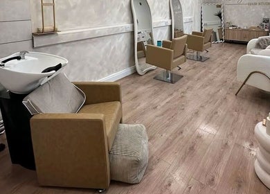 Elegant interior of Kelseigh Walsh Hair - Studio in Anstey, England, GB with stylish seating and chic decor.