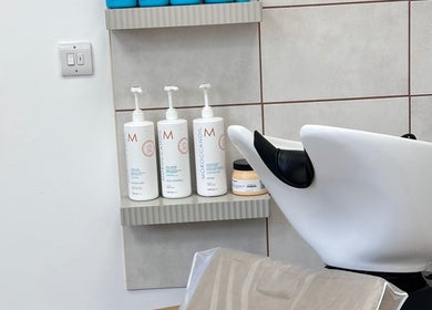 Shampoo station at Kelseigh Walsh Hair - Studio in Anstey, England, GB, showing MoroccanOil products.