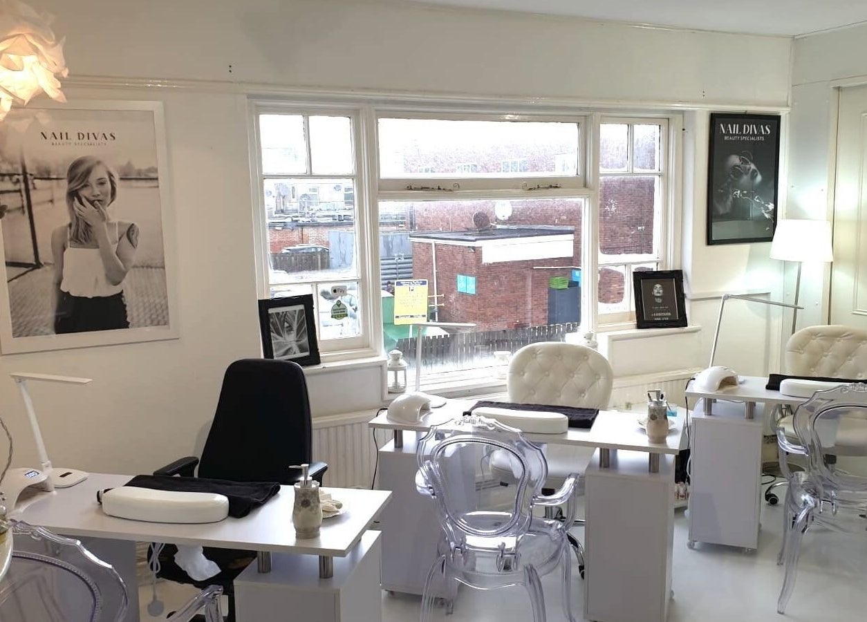 Cozy interior of Nail Divas, Newport, Wales, GB showcasing elegant nail treatment stations.