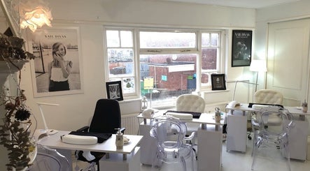 Cozy interior of Nail Divas, Newport, Wales, GB showcasing elegant nail treatment stations.