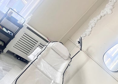 Relaxing treatment room at Studio H Aesthetics, Barbers & Hair, Norwich, England, GB with spa equipment.