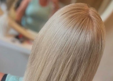 Blond hair styled sleekly at Studio H Aesthetics, Barbers & Hair in Norwich, England, GB.