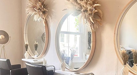 Chic salon mirrors at H Derma Beauti Aesthetics & Hair, Norwich, England, GB. Modern elegance and style.