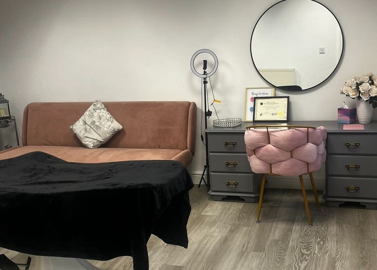 Elegantly designed beauty room at Timeless Cosmetics, King's Lynn, England, GB, featuring a plush sofa and modern decor.