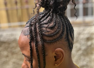 Intricate braided hairstyle at Tressed_bybrit, Montego Bay, St. James Parish, JM highlights unique styling.